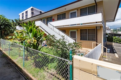 Two-story Apartment building with private outdoor spaces for each resident.
