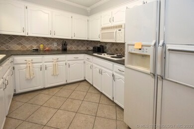 Cozy kitchen with upgraded tile.  Kitchen window t