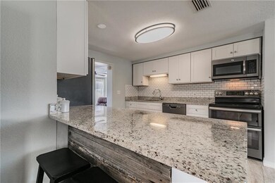Impressively remodeled kitchen with dark stainless