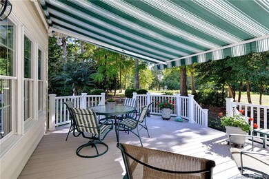 Spacious deck has retractable awning, Trex decking