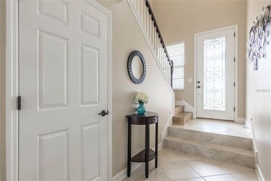 Luxurious entryway with wooden steps leading you t