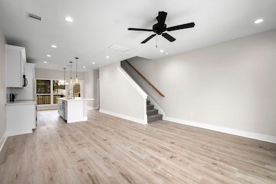 Living area on 1st floor. Open concept living. Sta