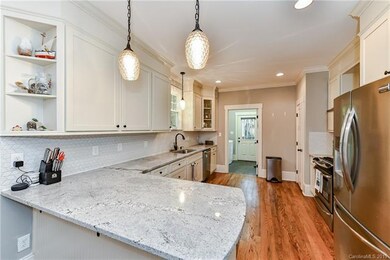 Beautiful kitchen with granite counters, stainless