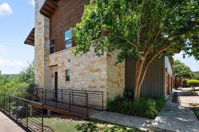 View of side of property with stone siding and a 