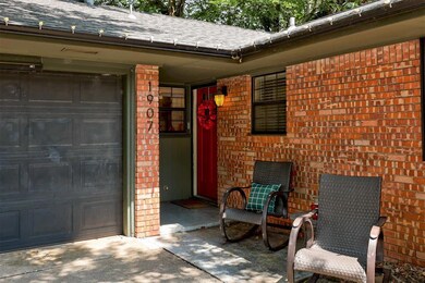 View of exterior entry with a garage
