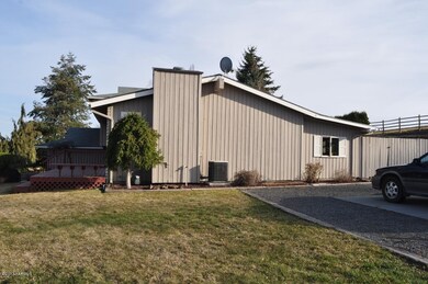 Side of home with RV parking pad