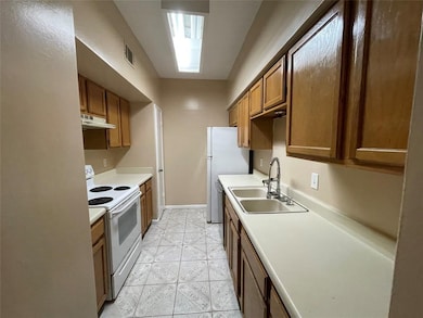 Kitchen features Electric Stove, Dishwasher & Refrigerator