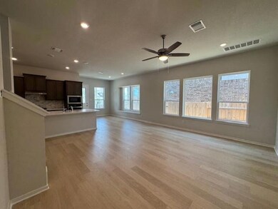 Unfurnished living room with light wood-style flo