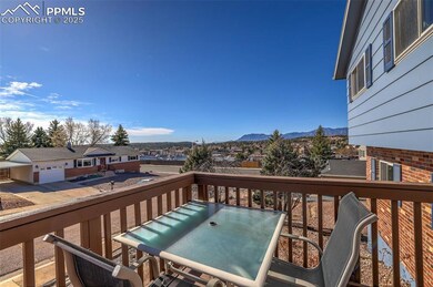 Wooden terrace with a residential view, a mountain