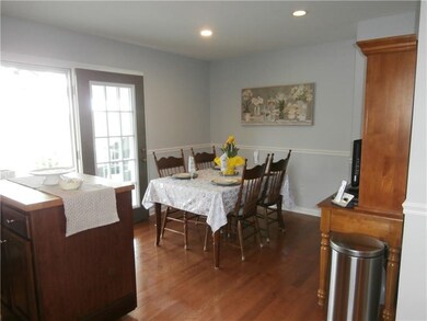 Eat-in-kitchen with French doors leading to covere