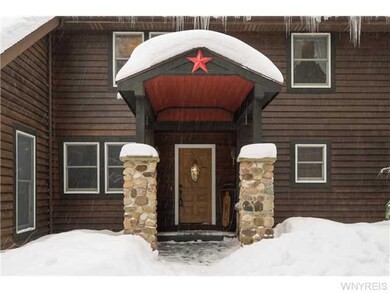 Exterior Front. Welcoming front entry with stone p
