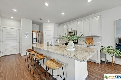 The massive 9' kitchen island is perfect for quick meals or entertaining.