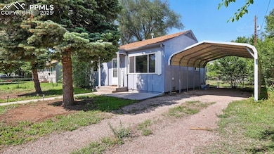 Mature trees on the lot with carport for your vehicle.