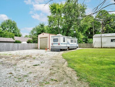 Immense 45 x 16 pole barn with concrete floor, 12' door opening and an engine lift!