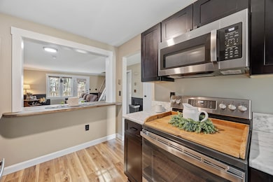 An added bar provides an eat-in space and view of the living room - perfect for entertaining