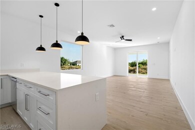 Kitchen featuring pendant lighting, dishwasher, wh