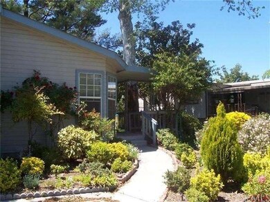 Inviting front entrance with roses.