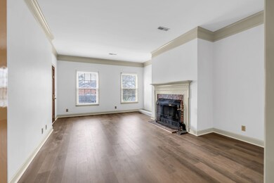 Newly installed hardwood floors flow throughout the home adding warmth and elegance.