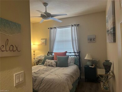 Bedroom featuring ceiling fan and wood finished fl