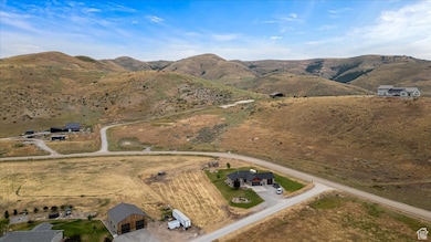 Birds eye view of property with a mountain view and a rural view