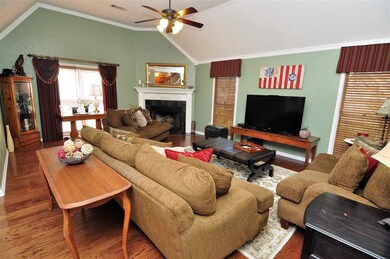 A cozy fireplace highlights the family-sized great