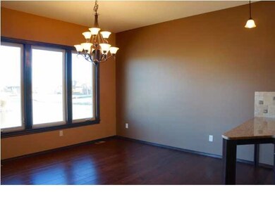 Dining room with lake view and entrance to the lar