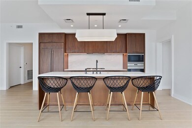 Large kitchen w/ custom walnut cabinetry
