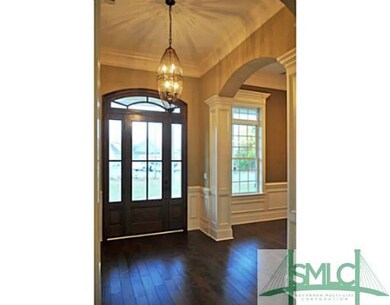 Foyer. Gorgeous front door with sidelights and tra
