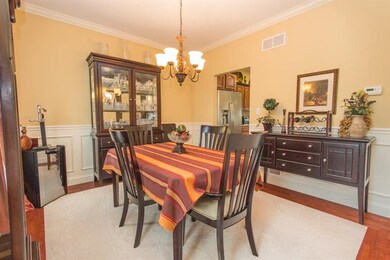 A formal dining room featuring hardwood permieter 