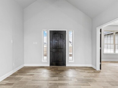 Foyer has coat closet, and leads to office.