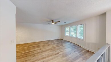 Spare room featuring light hardwood / wood-style f