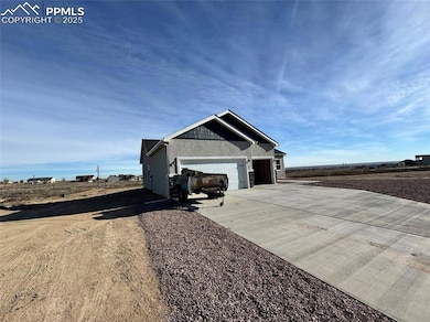 View of side of property featuring a garage