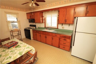 Eat-in kitchen with stove and refrigerator include