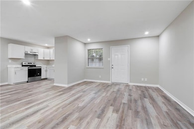 Unfurnished living room featuring light hardwood / wood-style floors