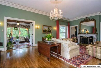 Lovely and spacious formal living room with wood b
