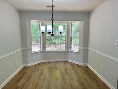 dining room has large bay window and new fixture
