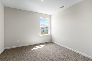 Empty room with baseboards and carpet