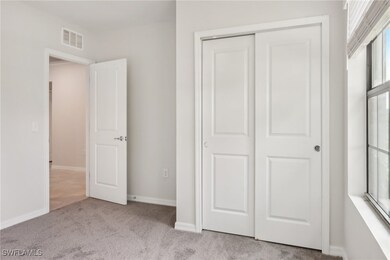 Unfurnished bedroom with a closet, baseboards, vis