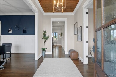 Foyer entrance featuring an inviting chandelier, d