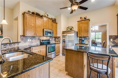 Stainless steel appliances & granite island comple