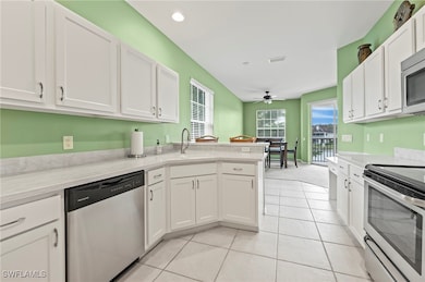 Kitchen featuring stainless steel appliances, whit