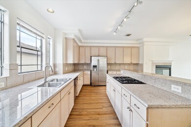 Impressive chef’s kitchen with quartz countertops, sleek cabinetry, and premium stainless steel appliances.