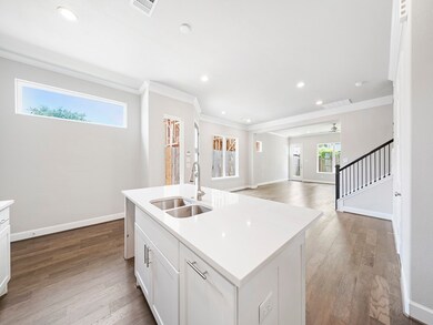 The kitchen is equipped with stainless steel appli