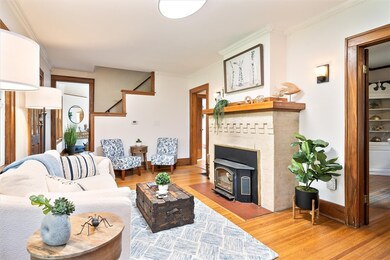 Living room with views into the dining room, kitch