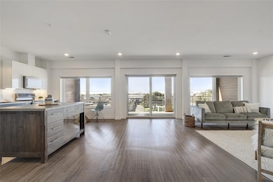 Sliding glass doors offer direct access to the oversized balcony