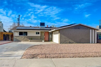 View of front of property with a garage, cooling u