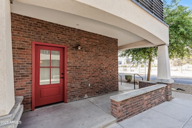 Front door & wraparound front porch.