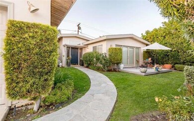Front of house is private and has a grassy yard pl