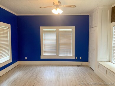 Empty room featuring ornamental molding, ceiling f