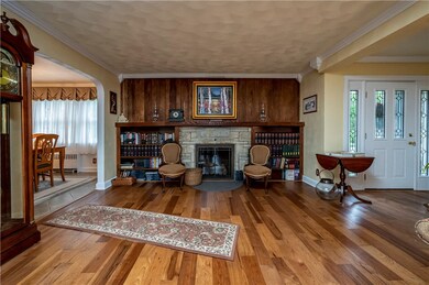 Living room with gas fireplace and wormy chestnut